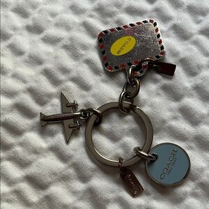 Coach Silver and Blue Airplane Keychain